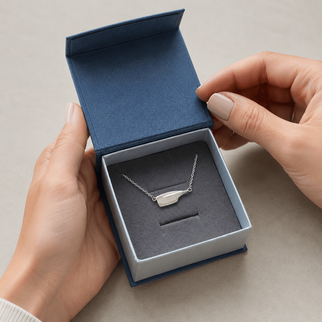 Rowing necklace worn as a meaningful gift for rowers